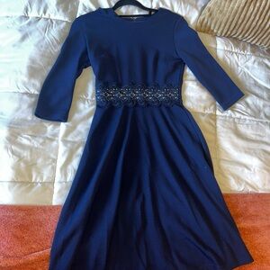 Navy blue dress with lace detailing on waist